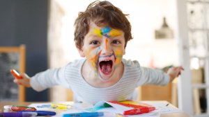 Boy playing with felt pens