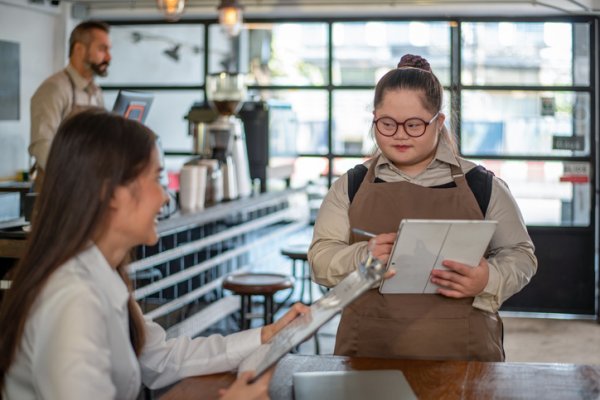 Autistic girl working in her family's coffee shop