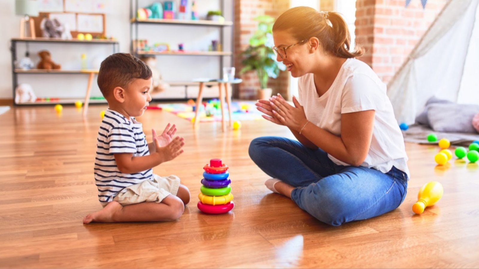 Mom playing clapping game with son | Magellan Health