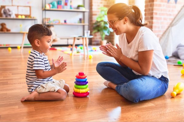 Mom playing clapping game with son | Magellan Health