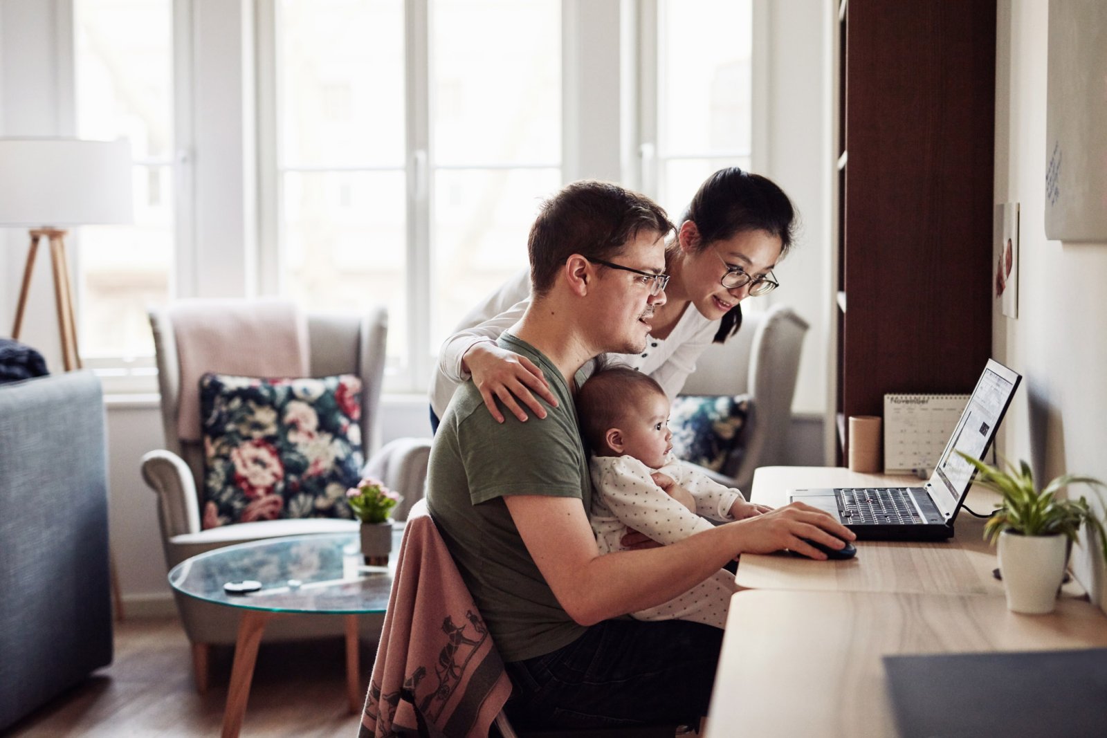 Shot of a couple looking at something on a laptop